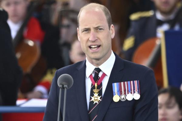 Prince William, Duke of Cambridge, giving a speech at the 80th anniversary D-Day commemorative event in Portsmouth, England, wearing a suit adorned with five medals