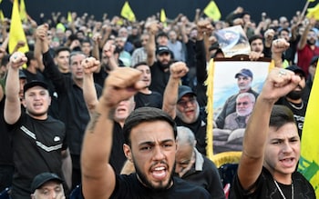 Supporters of Hezbollah shout slogans as they listen to Nasrallah vows a 'strong' respo<em></em>nse on Israel