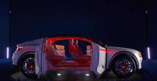 Side view of the Qualcomm Digital Chassis Electric Vehicle with the doors open