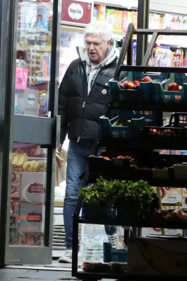 Phillip Schofield leaving a shop