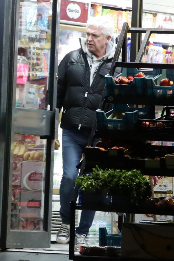 Phillip Schofield in a corner store.