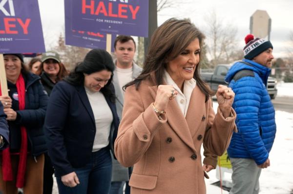 Nikki Haley gestures while walking with supporters, Tuesday, Jan. 23, 2024, near a polling site at Winnacunnet High School in Hampton, N.H.
